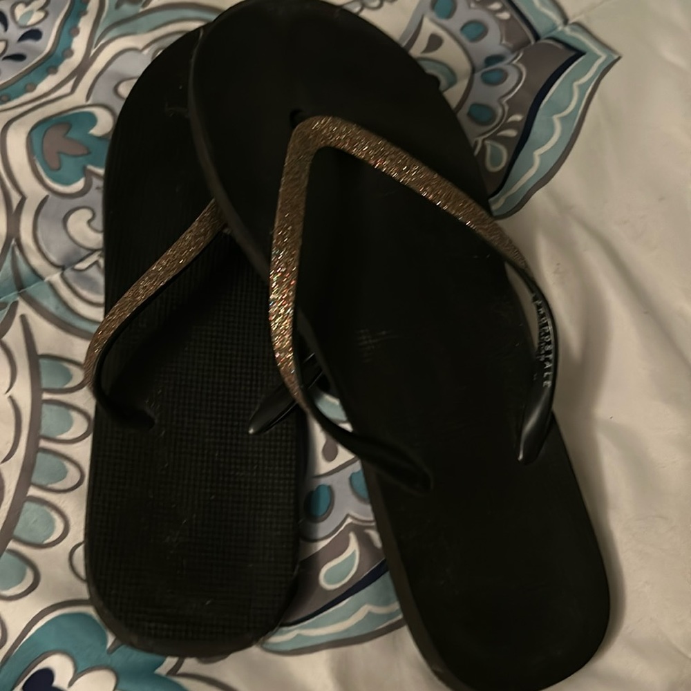 Black flip flops size 9-10